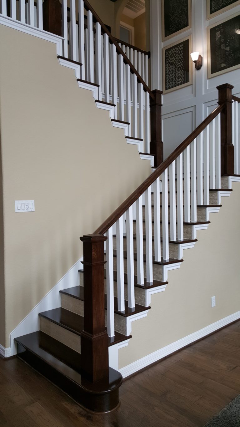Traditional wood stair by Ironwood Connection