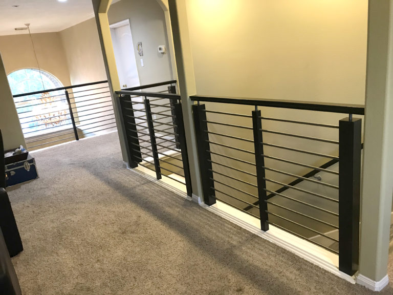 Remodeled staircase with iron balusters